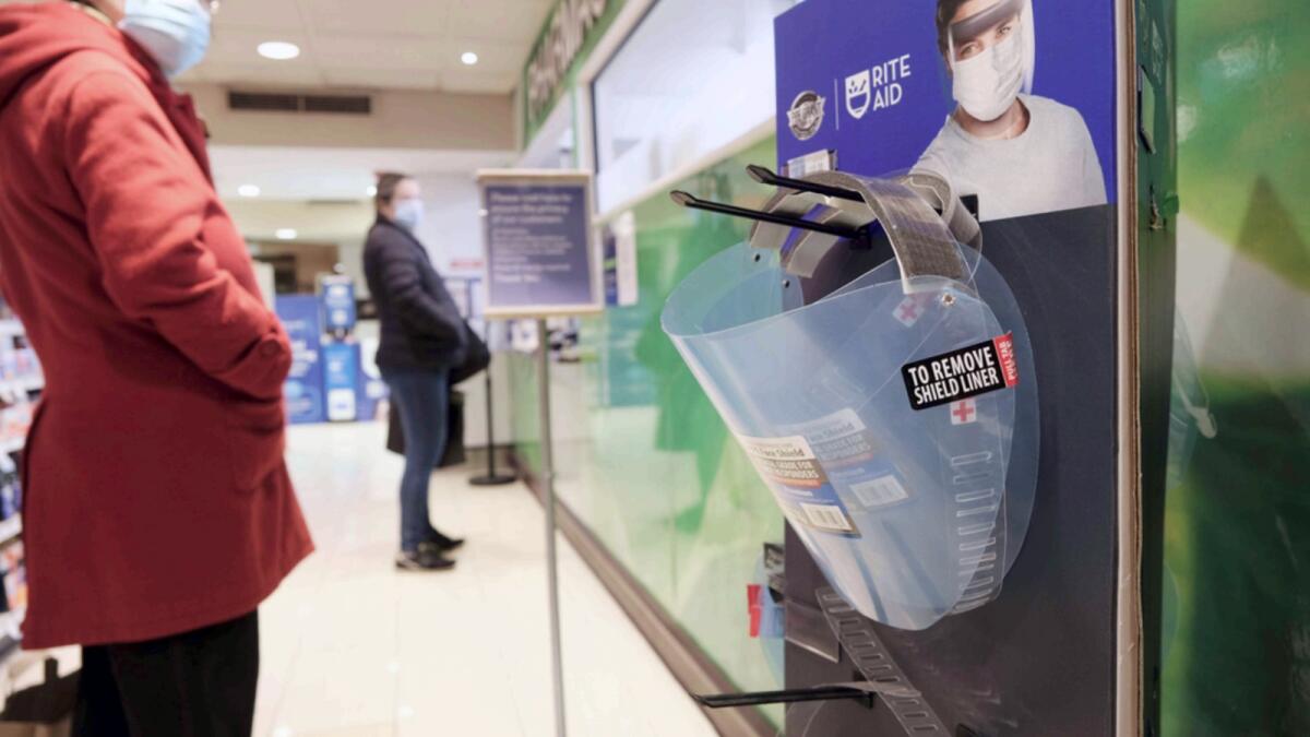 Face shields used to prevent the transmission of Covid-19 sit for sale in a pharmacy in Grand Central Terminal in New York. — AFP