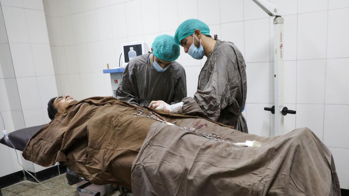 A wounded man receives treatment at a hospital after an attack at the university of Kabul, Afghanistan November 2, 2020.