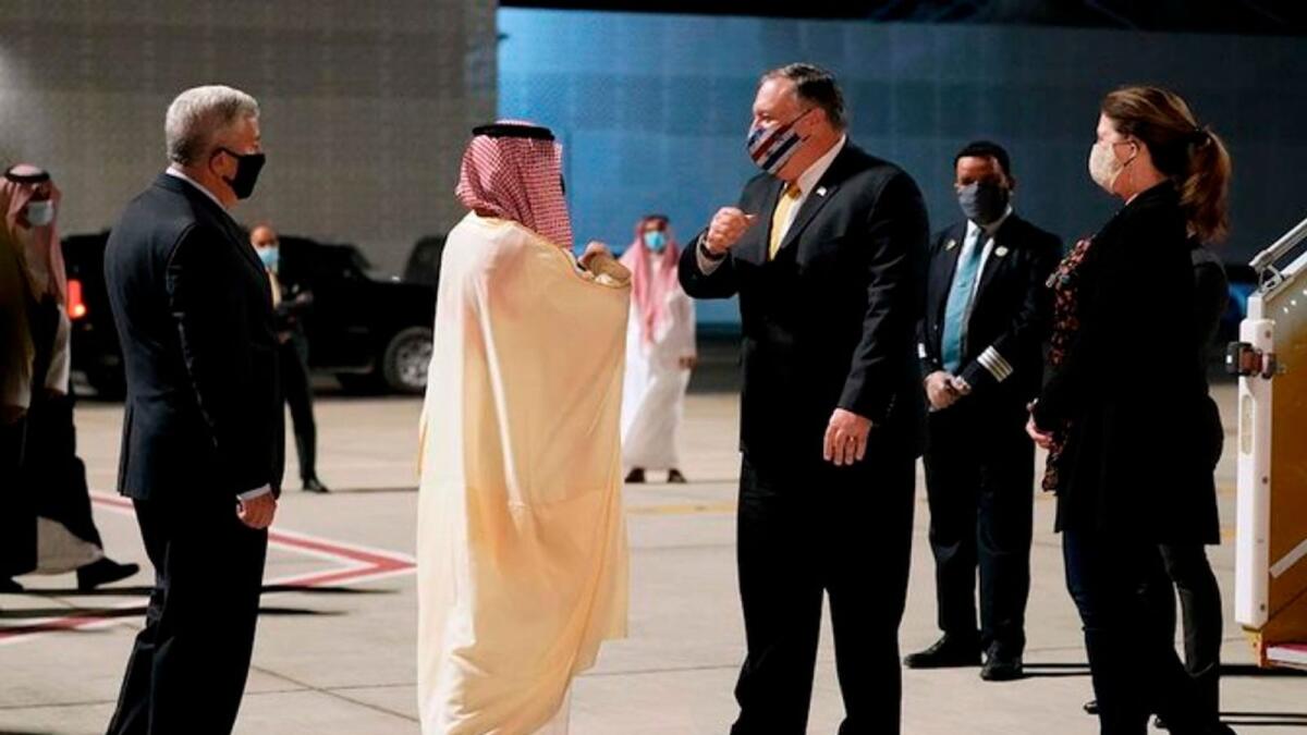 US Ambassador to Saudi Arabia John Abizaid (left) and Saudi foreign minister Prince Faisal bin Farhan greet US Secretary of State Mike Pompeo and his wife Susan as they arrive at Neom, Saudi Arabia.