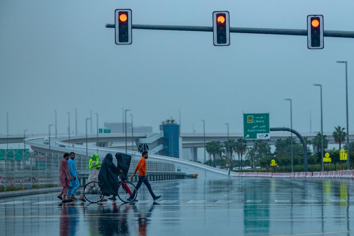 Pedestrians cross the road in Deira Dubai. KT Photo: Shihab