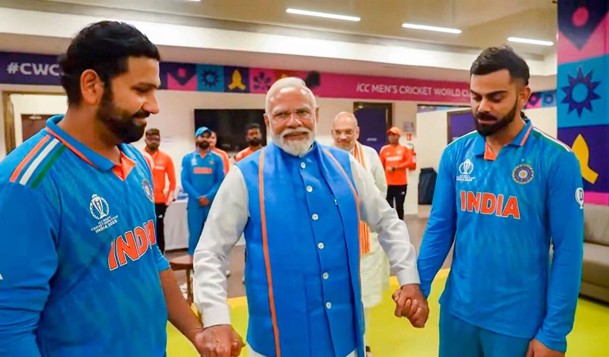 Indian prime minister Narendra Modi with captain Rohit Sharma and Virat Kohli after the ICC World Cup final defeat to Australia. — PTI