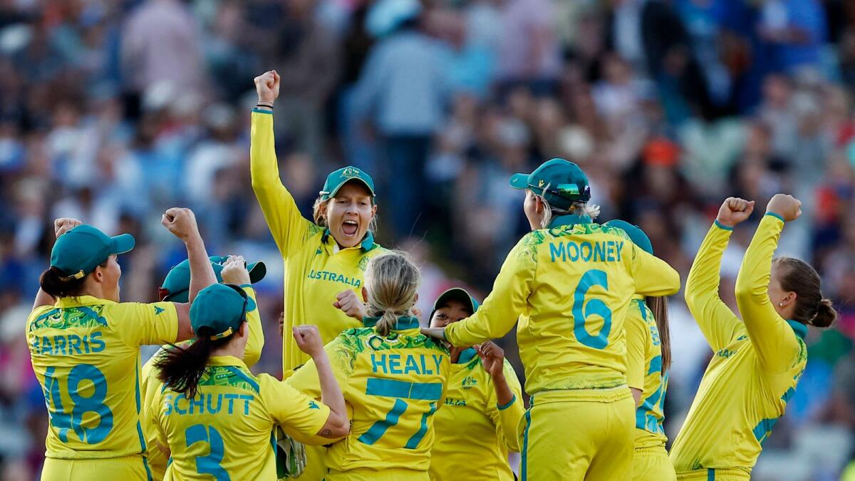 Australian players celebrate after winning the gold. — Reuters