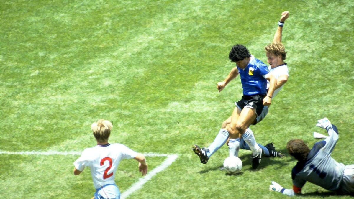 Diego Maradona scores what has been labelled as the 'Goal of the Century' against England in the 1986 World Cup quarter-final.