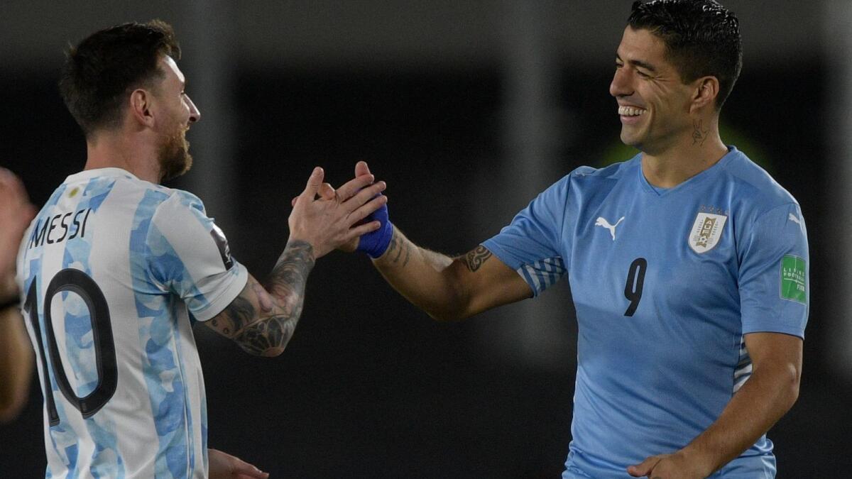 Argentina's Lionel Messi (L) and Uruguay's Luis Suarez have a good relationship since they were teammates at Barcelona for several years. - AFP
