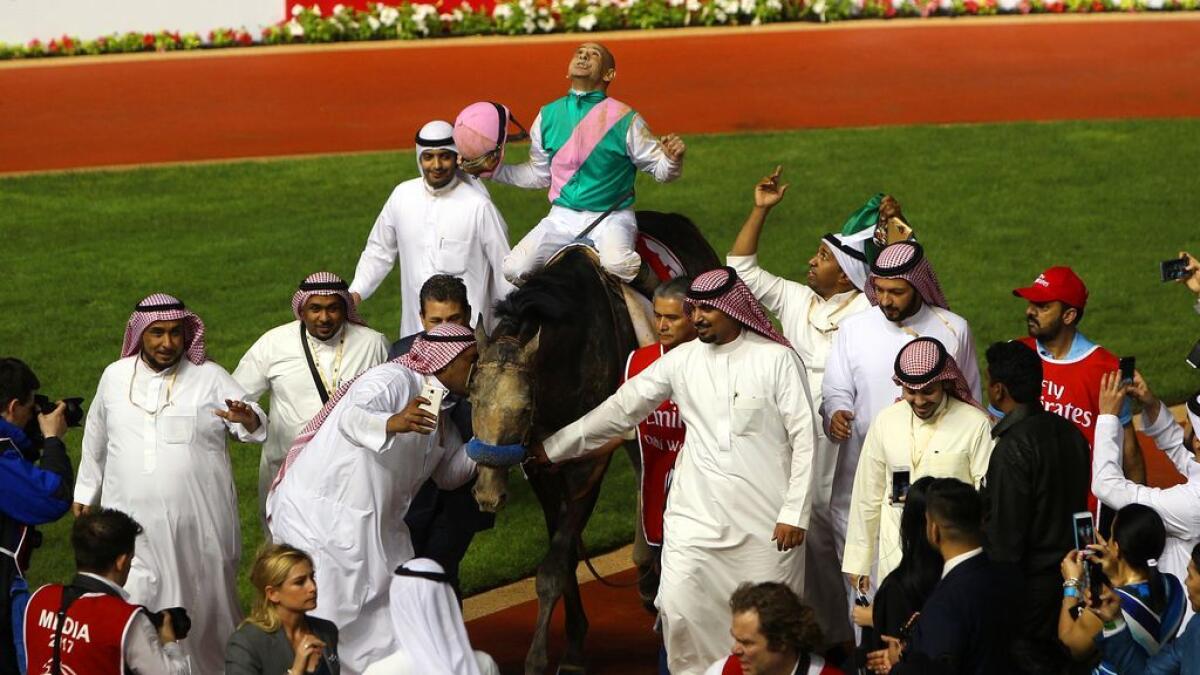 Mike Smith, jockey of winning Dubai World Cup horse Arrogate (USA) celebrates the victory. -Photo by Juidin Bernarrd/ Khaleej Times