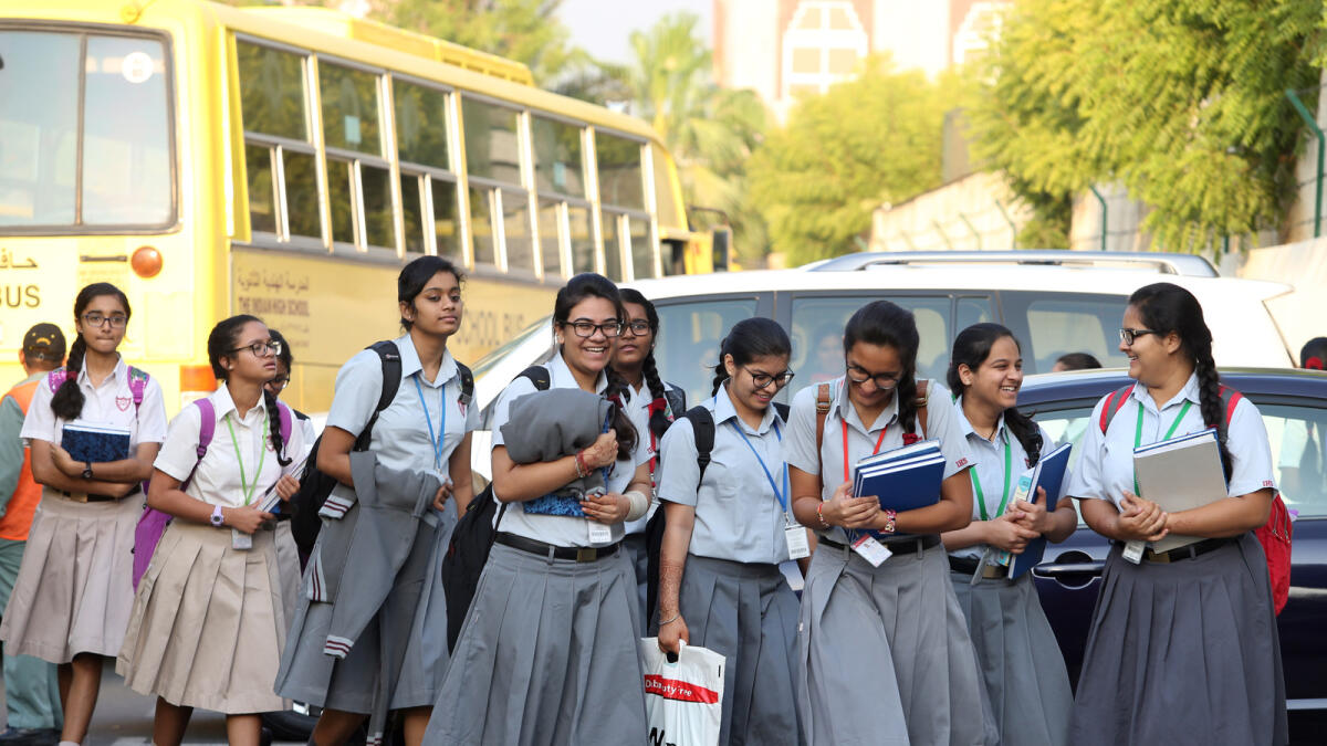 Students arrive at the Indian High School, Dubai, on their first day after the summer break. Dhes Handumon/KT Photographer