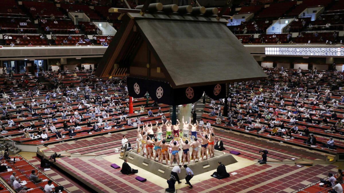 Spectators are seen as sumo wrestlers hold a ring-entering ceremony at the July Grand Sumo Tournament at Ryogoku Kokugikan in Tokyo, Japan on Sunday, in this photo taken by Kyodo. - Reuters