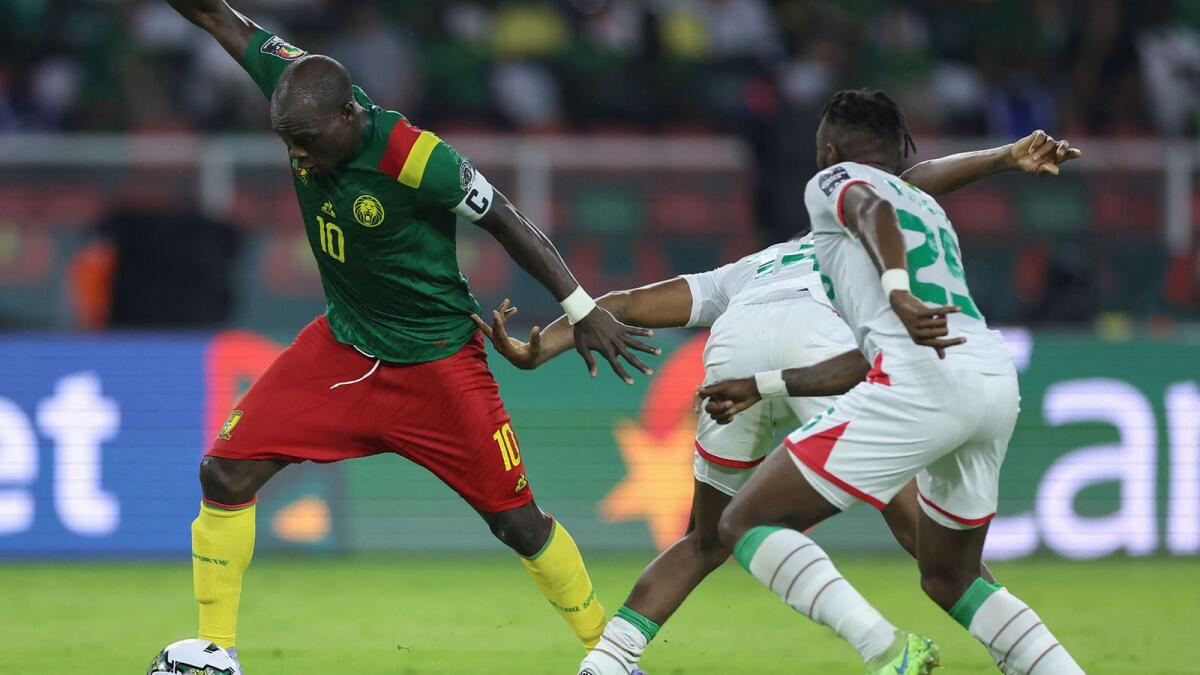 Cameroon's forward Vincent Aboubakar (left) controls the ball as he is marked by Burkina Faso's defender Steeve Yago. (AFP)
