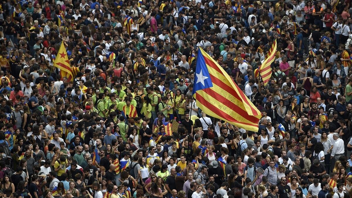 Thousands of Catalans take to streets to protest police action