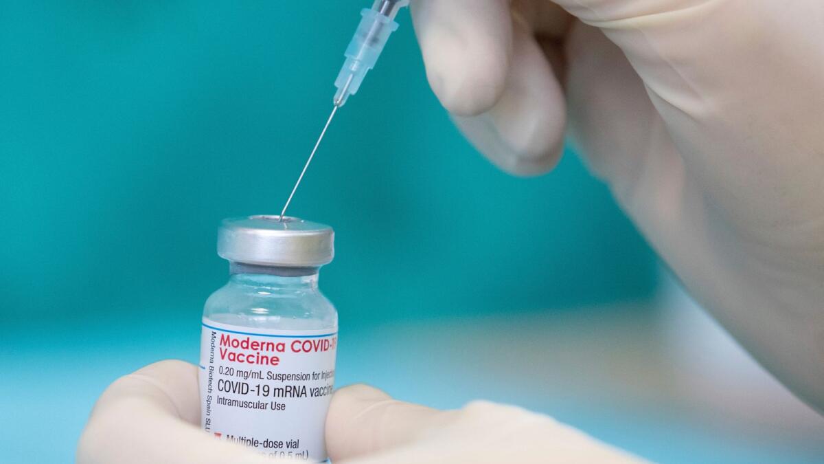 A nurse draws up the vaccine of the manufacturer Moderna against the coronavirus with a syringe in a posed situation a the vaccination centre in Bielefeld, Germany, Friday, April 16, 2021. Photo: AP