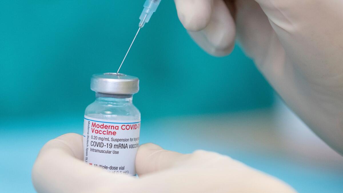 A nurse draws up the vaccine of the manufacturer Moderna against the coronavirus with a syringe in a posed situation a the vaccination centre in Bielefeld, Germany, Friday, April 16, 2021. Photo: AP