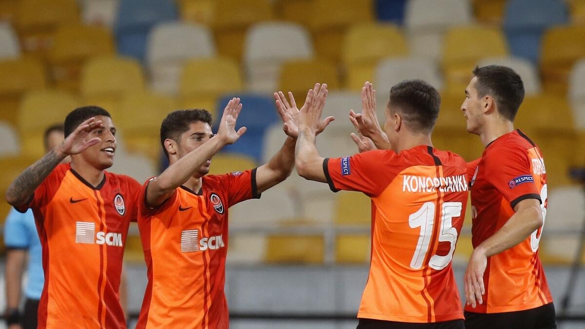 Shakhtar's Manor Solomon celebrates with teammates after scoring his side's second goal. (AP)
