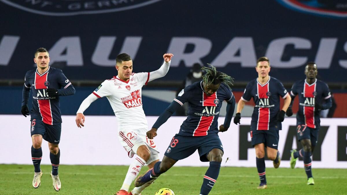 Brest's French midfielder Romain Faivre (centre left) fights for the ball with Paris Saint-Germain's Italian forward Moise Kean. — AFP