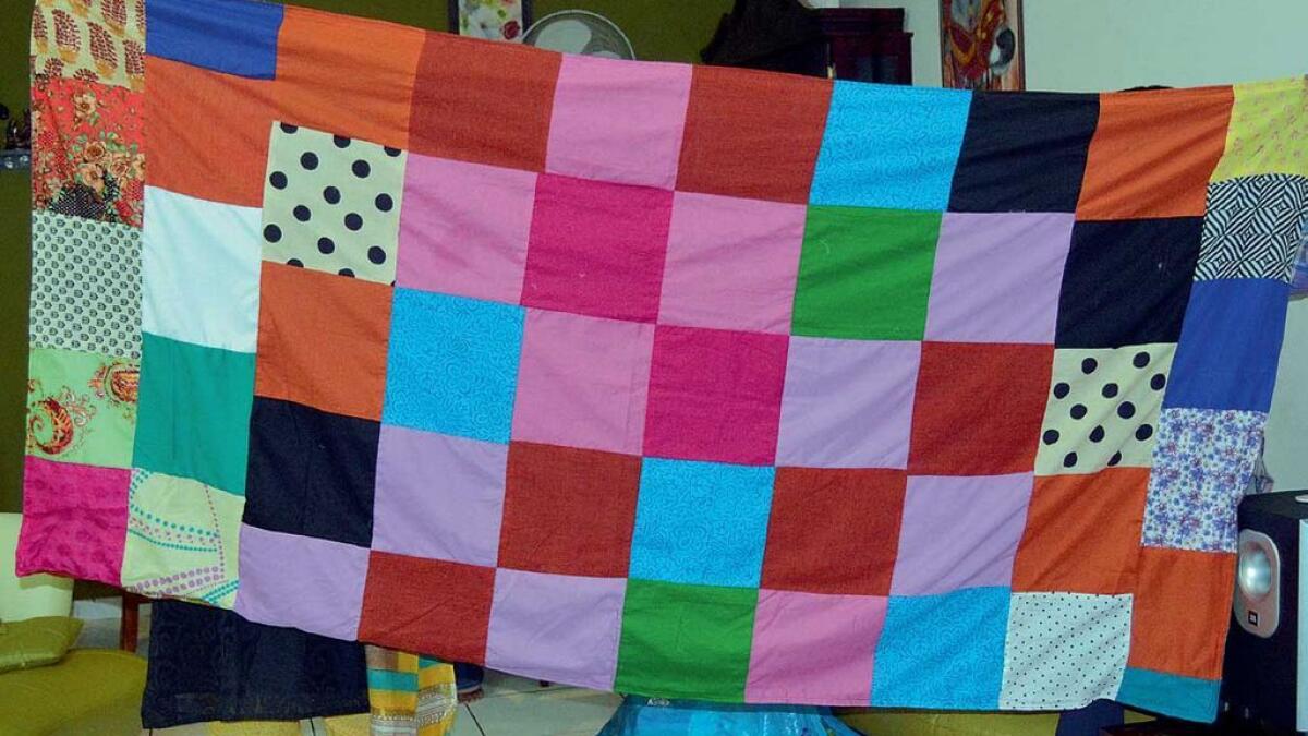 A bedsheet made from scraps of fabric, which are usually discarded by boutiques.