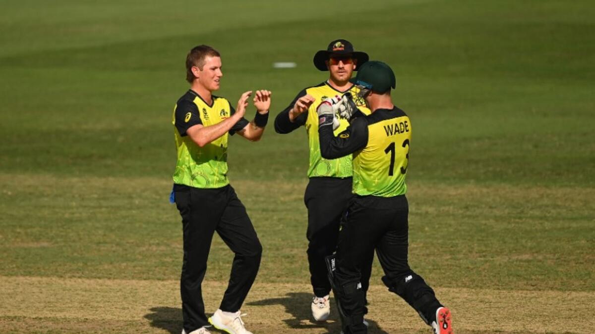 Adam Zampa (left) celebrates a wicket with his teammates. (ICC Twitter)