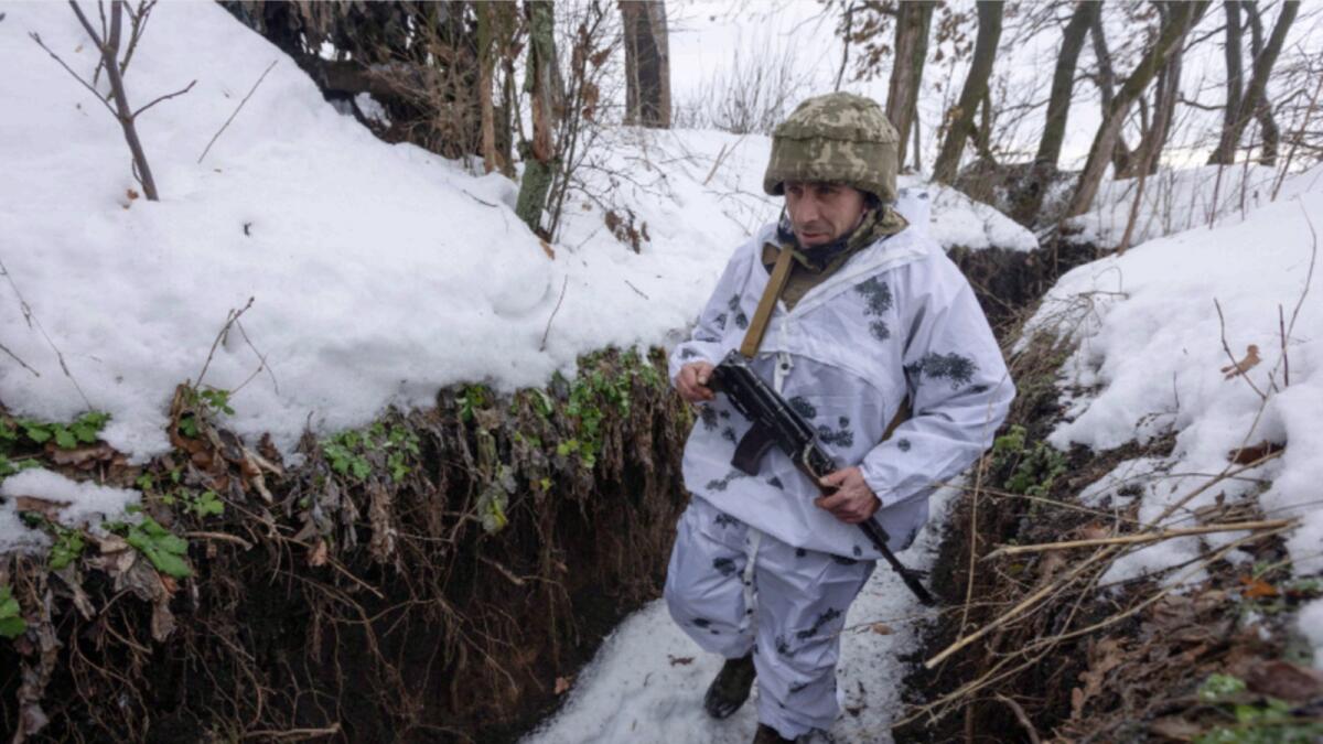 A Ukrainian soldier walks at the line of separation from pro-Russian rebels, Donetsk region, Ukraine. — AP