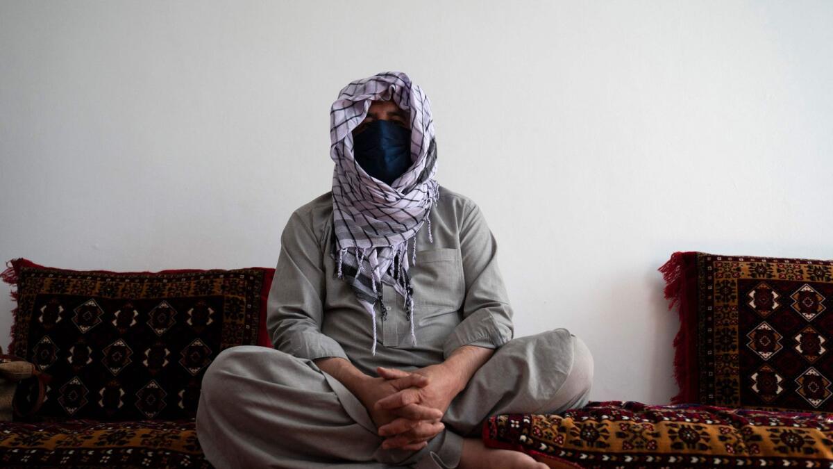 Qadir, father of Maryam, 16, speaks during an interview with AFP at a house in Charikar, Parwan province. — AFP