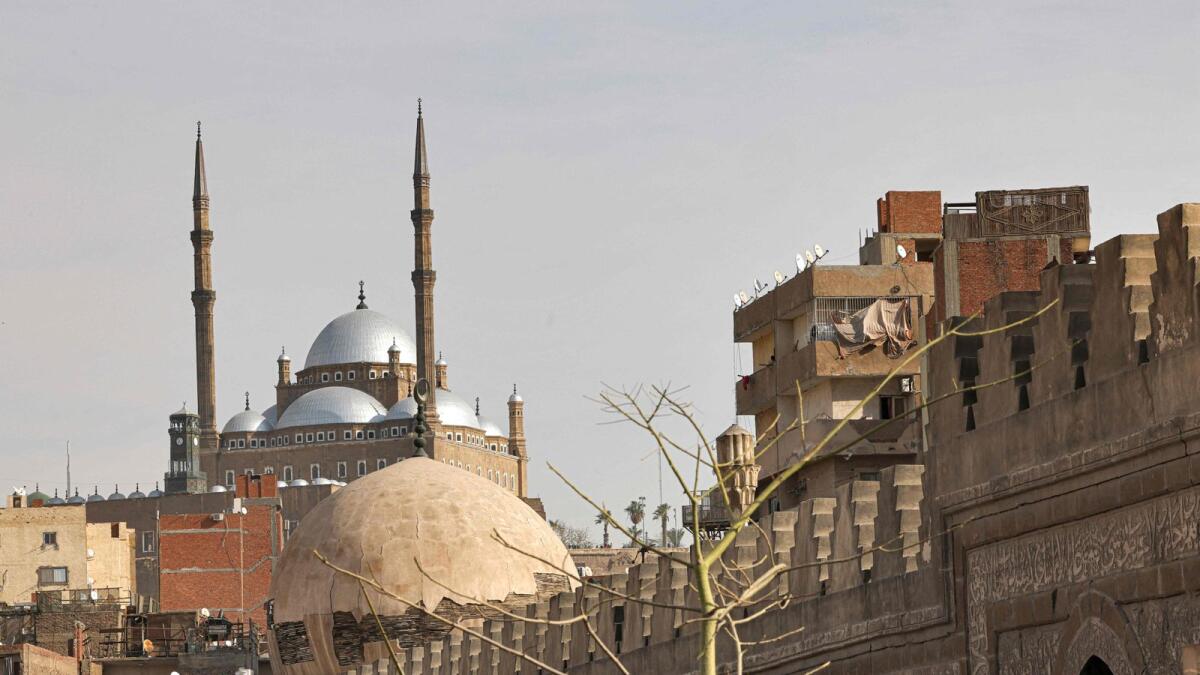 The Mohammed Ali mosque (above) is seen inside the Salaheddine Citadel, behind part of  Shaykhu Mosque (below) in Cairo's Al-Khalifa district, on January 11, 2023.  — AFP