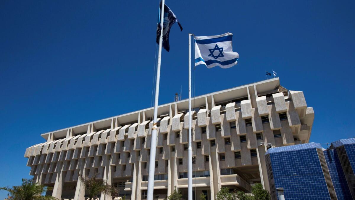 An Israeli flag flutters outside the Bank of Israel building in Jerusalem. — Reuters file photo