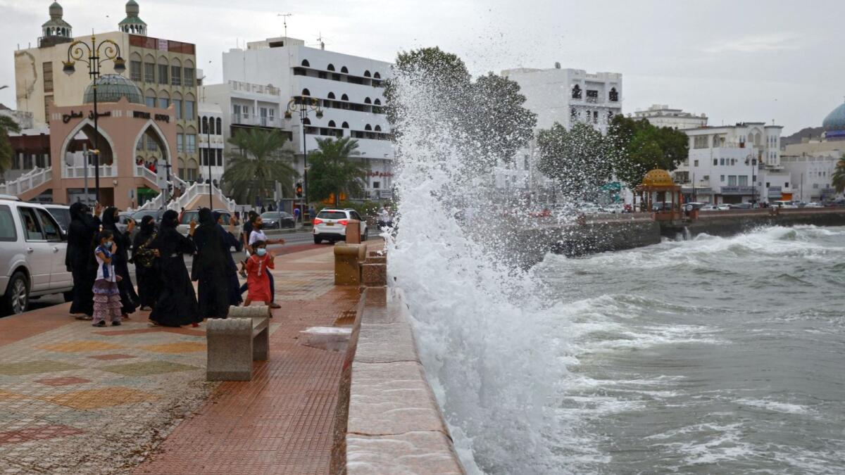 High waves break on the sea side promenade in the Omani capital Muscat. – AFP