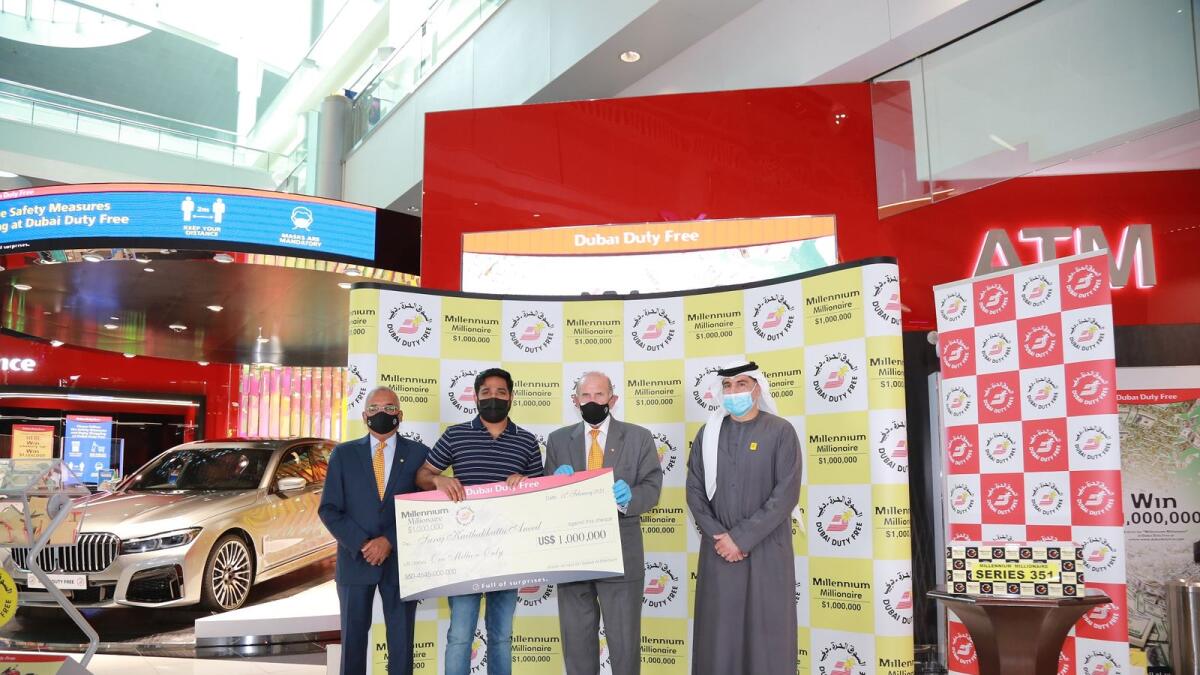 Suraj Aneed, winner of the previous Millennium Millionaire, receives a ceremonial cheque from Dubai Duty Free officials. - Supplied photo