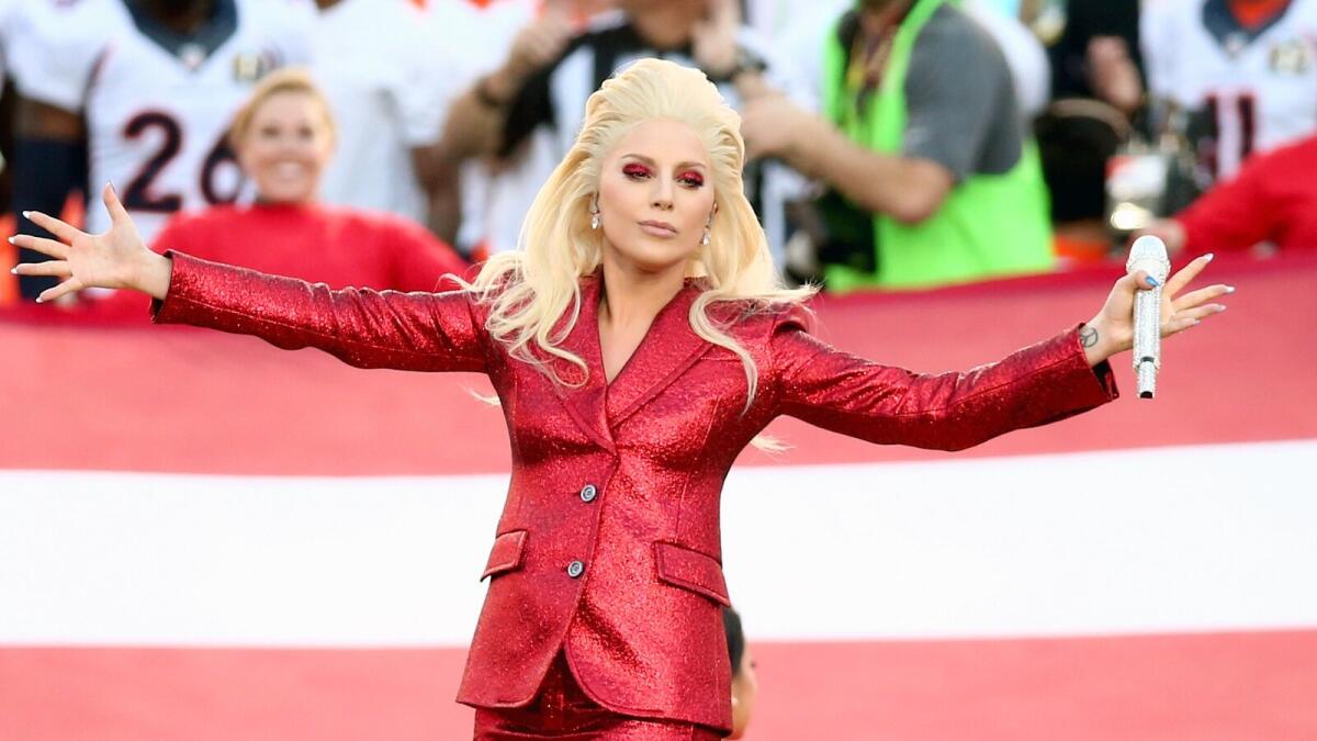 Lady Gaga decked out in a glittery red outfit and makeup, kicked off the Big Game at Levi’s Stadium with her version of the National Anthem, undoubtedly drawing in younger viewers after she was announced earlier this week