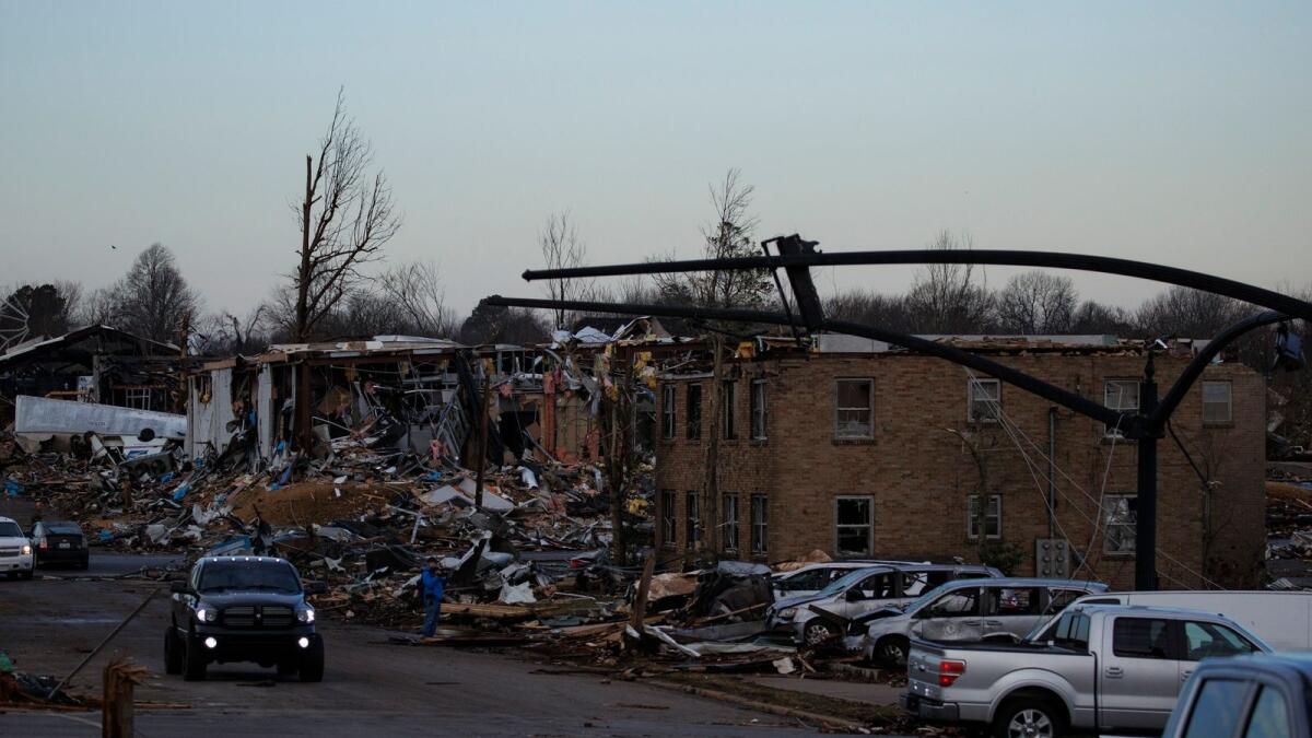 Heavy damage is seen downtown after a tornado swept through the area on December 11, 2021 in Mayfield, Kentucky. Multiple tornadoes tore through parts of the lower Midwest late on Friday night leaving a large path of destruction and unknown fatalities.   Brett Carlsen/Getty Images/AFP (Photo: AFP)