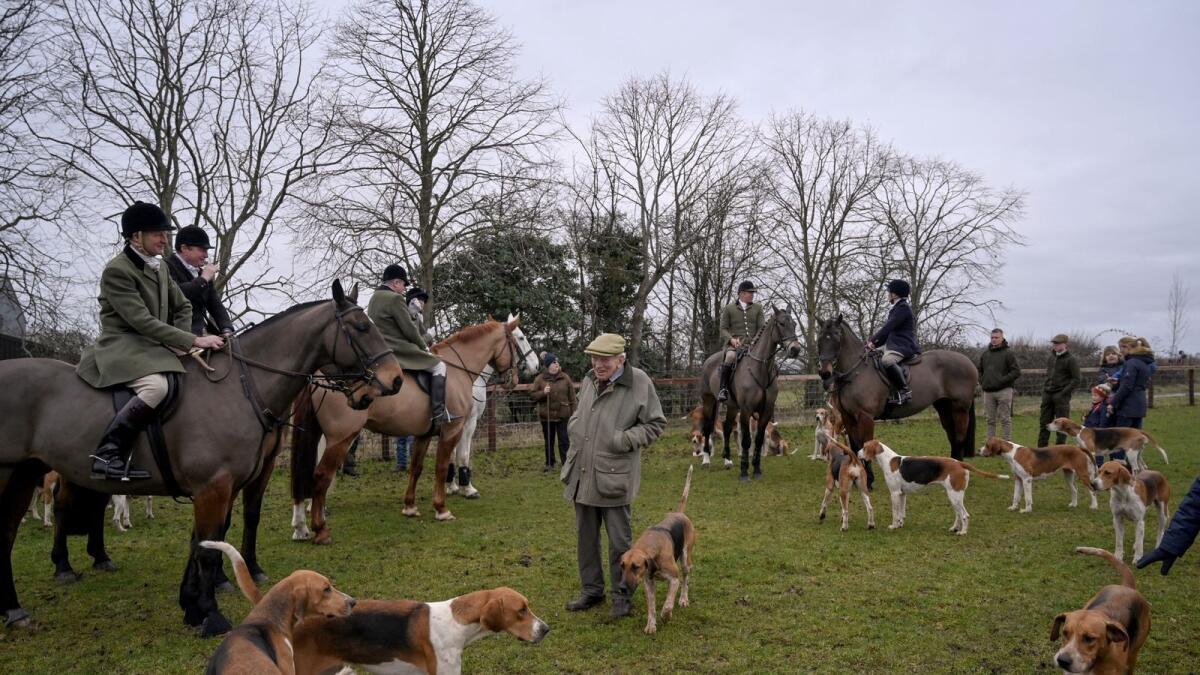Warwickshire Hunt members during a ride in Warwickshire County, England, on February 4, 2023. Some hunt groups still ride out even though the hunting of foxes using dogs was banned in 2004, and anti-hunt activists, who say the hunts are exploiting loopholes in the law, are confronting them in a very British clash of class, tradition and town versus country. (Mary Turner/The New York Times)