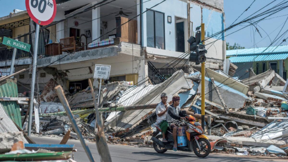 Lombok lifted 10 inches by quake that killed nearly 400