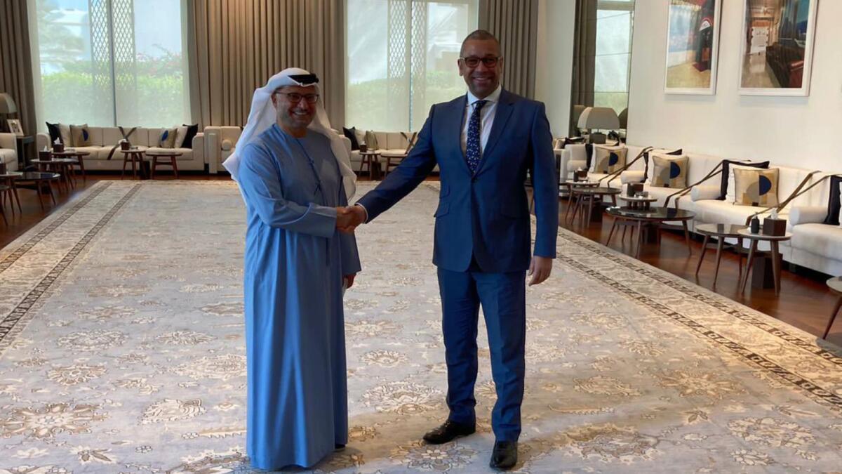 Dr Anwar Gargash with James Cleverly in Abu Dhabi. — Courtesy: Twitter