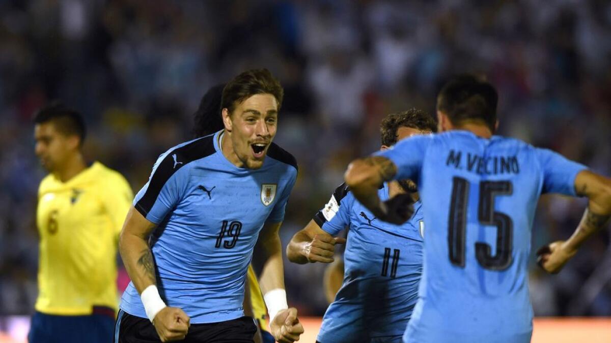 Football: Uruguay keep WC hopes alive with defiant victory