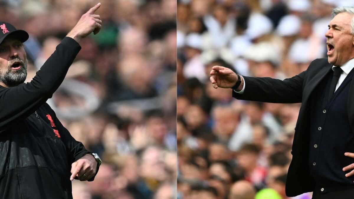 Liverpool manager Jurgen Klopp (left) and Real Madrid Carlo Ancelotti. — AFP