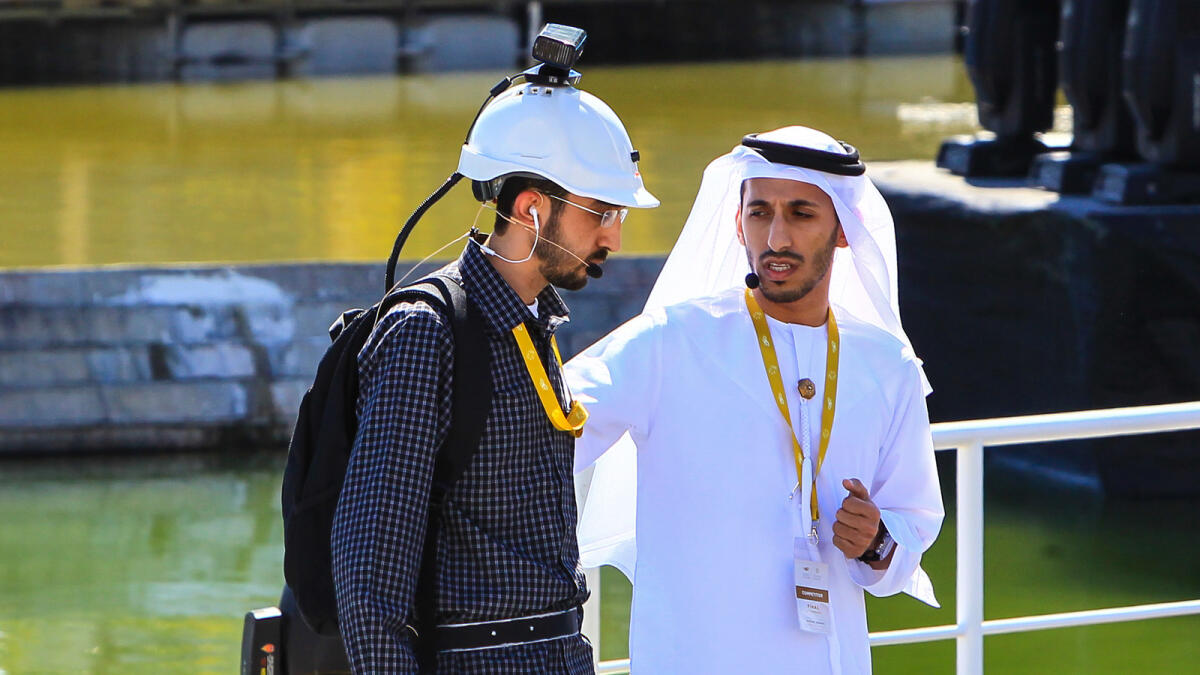 Participants demonstrating a smart guidance system that assists the blind in avoiding physical obstacles during the finals of the UAE Drones for Good Awards. Photo by Neeraj Murali.