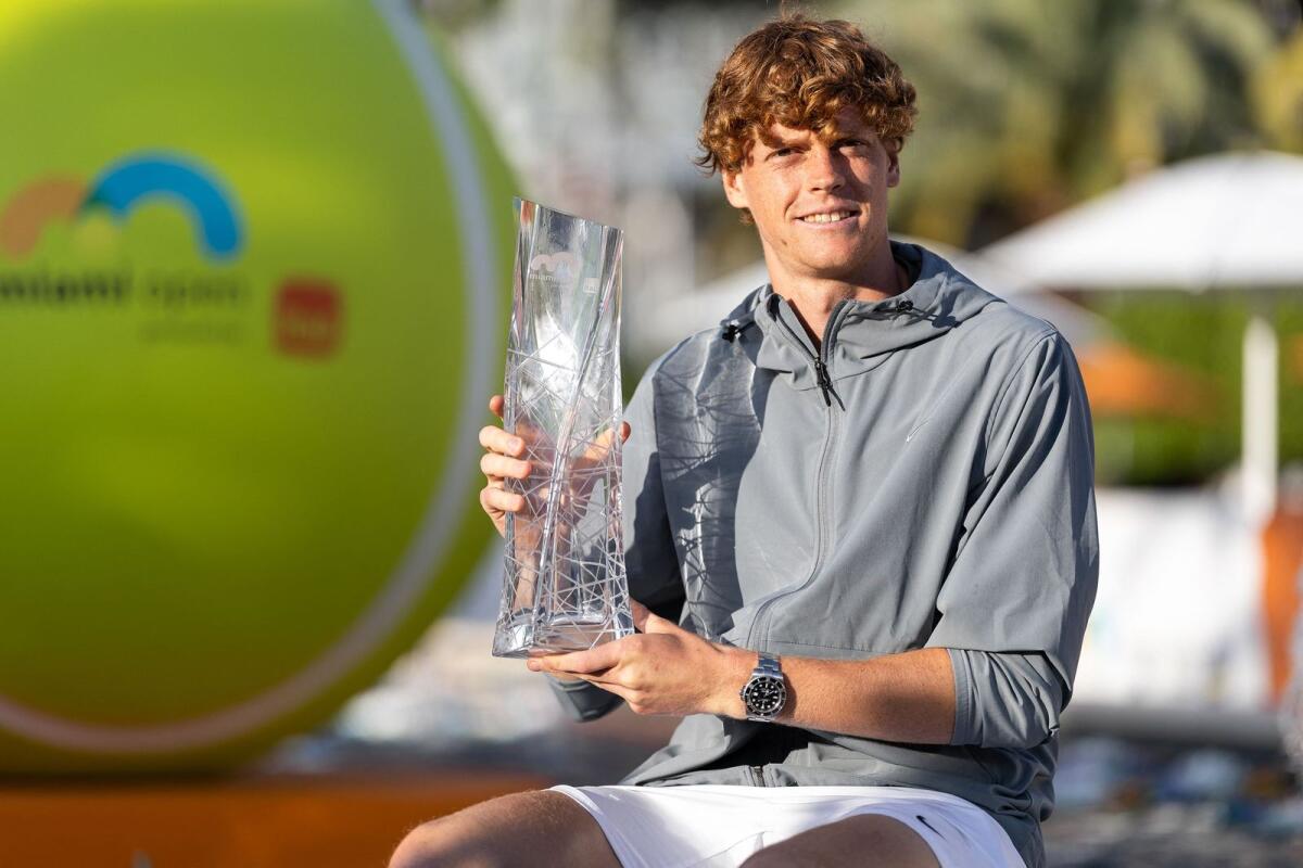Jannik Sinner of Italy poses with the Miami Open trophy. — AFP