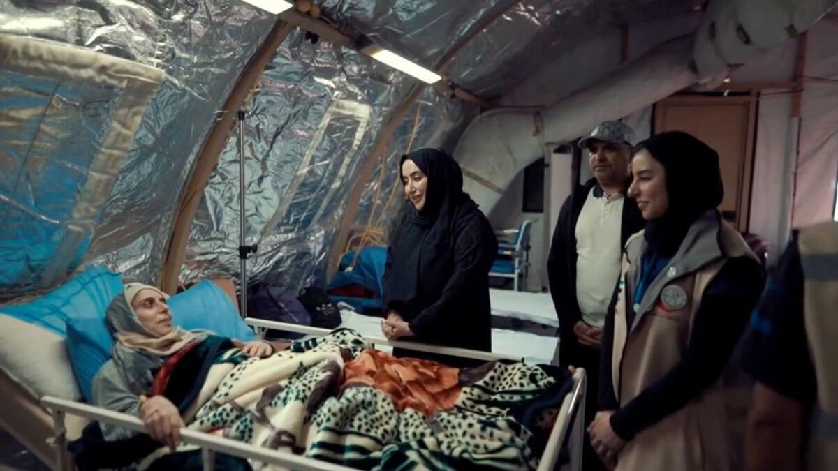 Members of the UAE delegation interact with patients at the integrated field hospital in Gaza Strip. — Wam