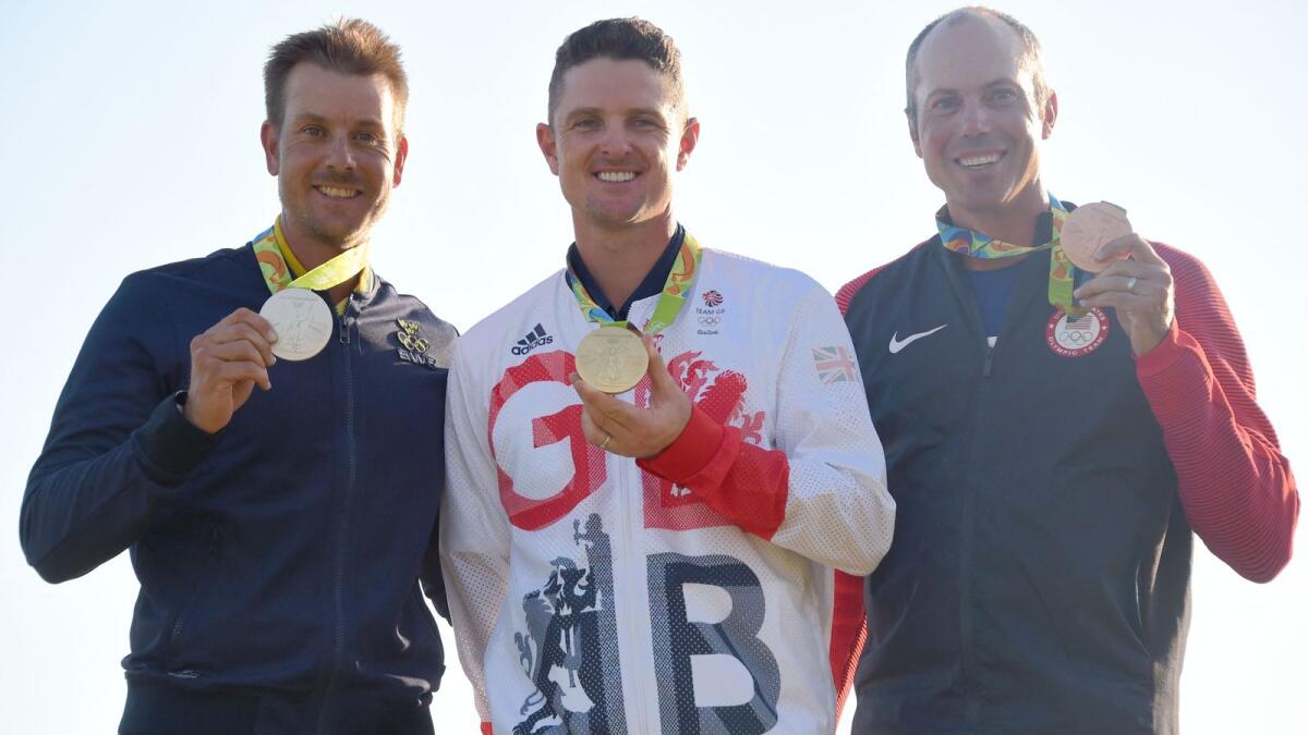 (From left) Sweden's Henrik Stenson (silver), Britain's Justin Rose (gold) and USA's Matt Kuchar (bronze) pose with their medals at the 2016 Olympics. (AFP file )