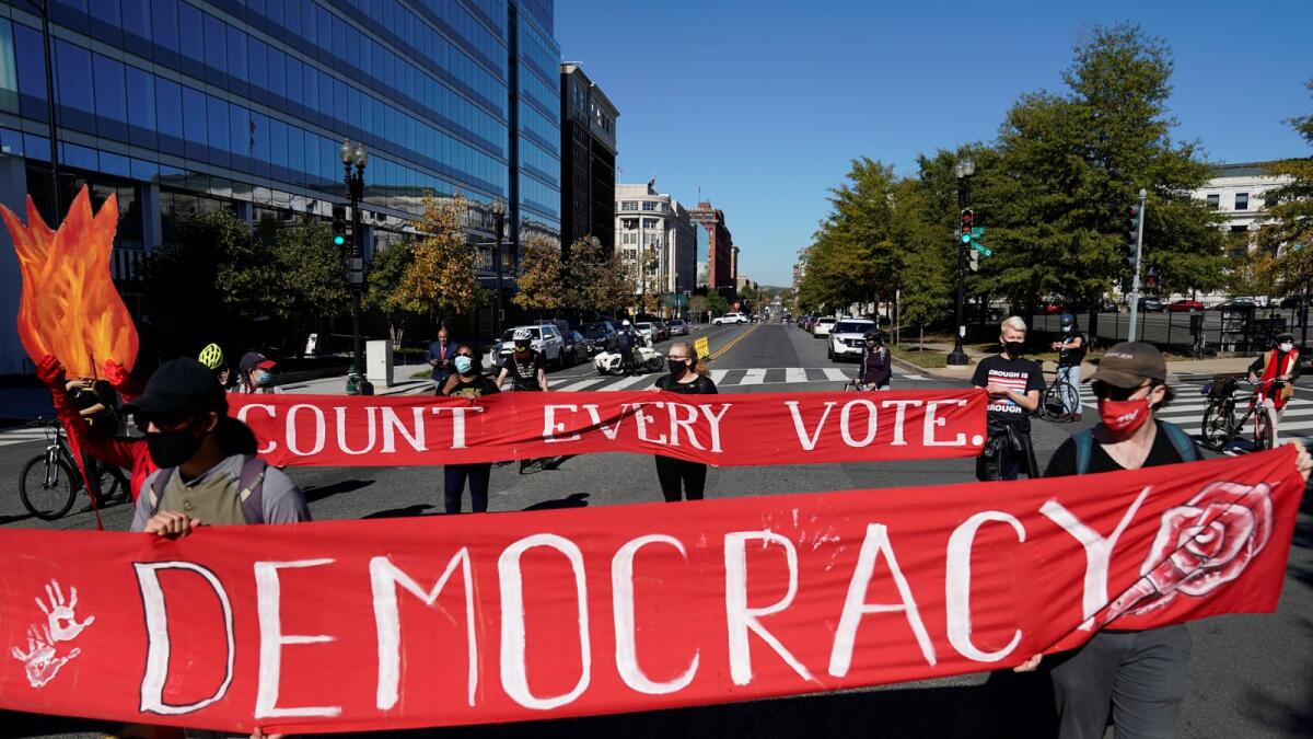 Activists take part in a protest led by shutdownDC the day after the 2020 U.S. presidential election in Washington, U.S., November 4, 2020.