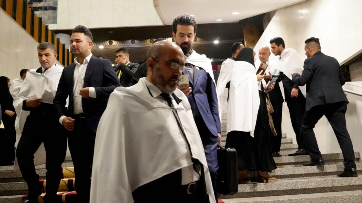 Lawmakers belonging to  cleric Muqtada Al Sadr's parliamentary bloc prepare to attend a parliamentary session in Baghdad. – AP