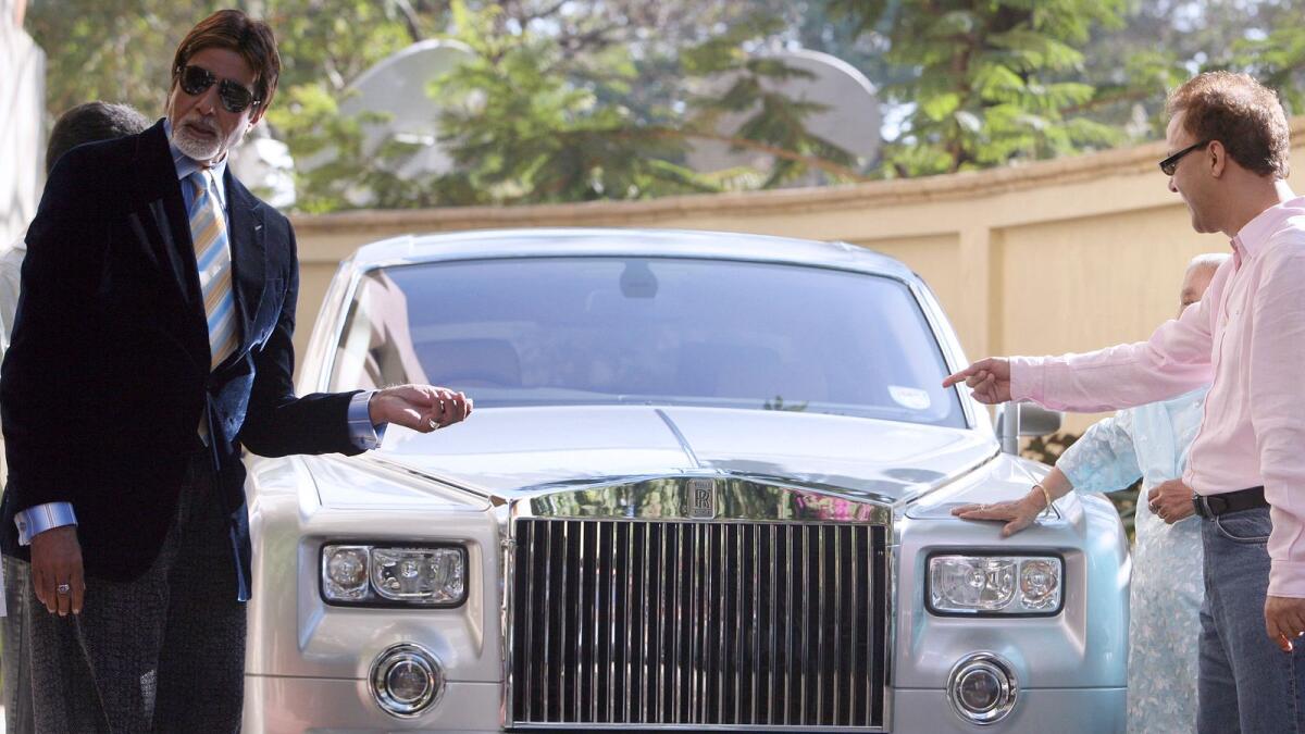 Actor Amitabh Bachchan and director Vidhu Vinod Chopra pose with a Silver Phantom Rolls Royce car during the promotion of their film Eklavya -The Royal Guard, in 2007.  Photo: AFP