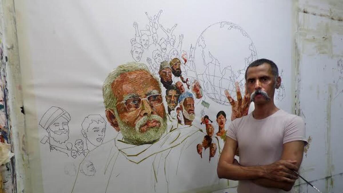 Saheb said his series of 4.5 feet by 6 feet Modi portraits - were inspired by his accomplishments.