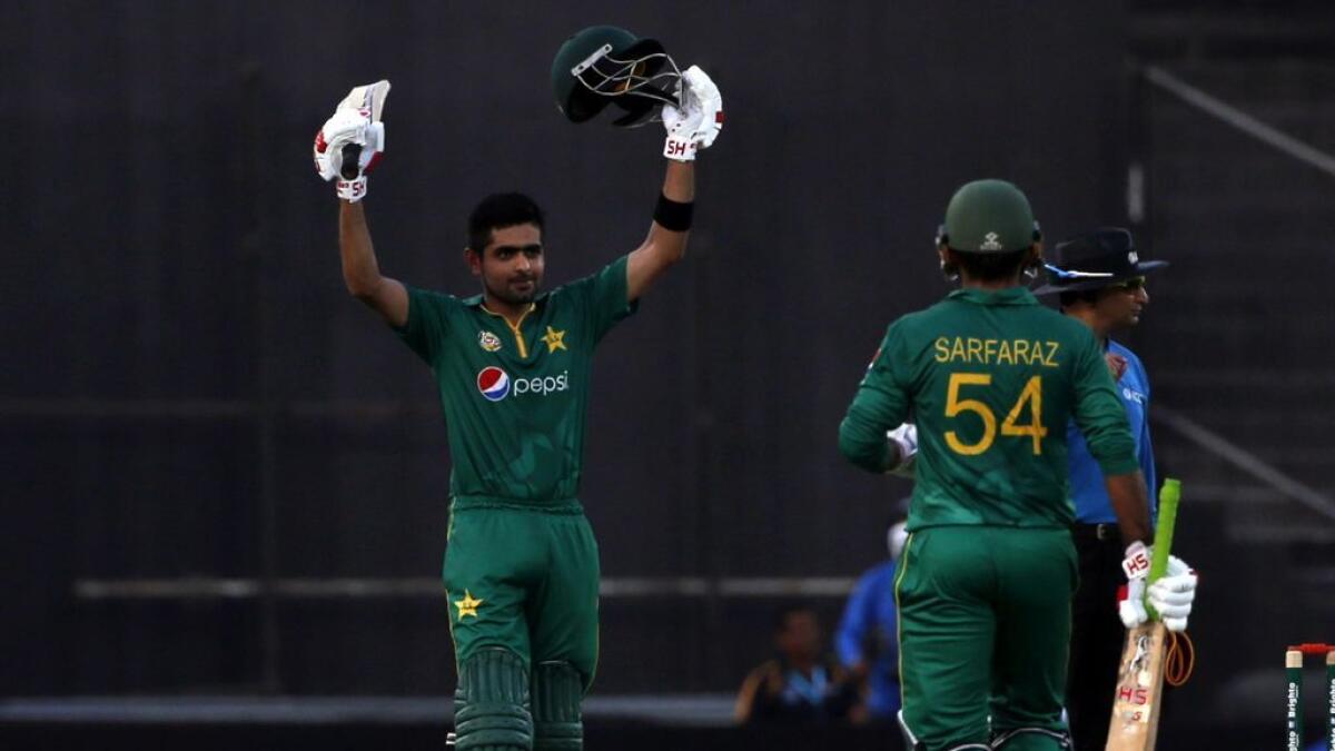 Pakistans batsman Babar Azam (L) celebrates with teammate Sarfraz Ahmed (R) during the 2nd ODI match between Pakistan and West Indies at the Sharjah Cricket Stadium