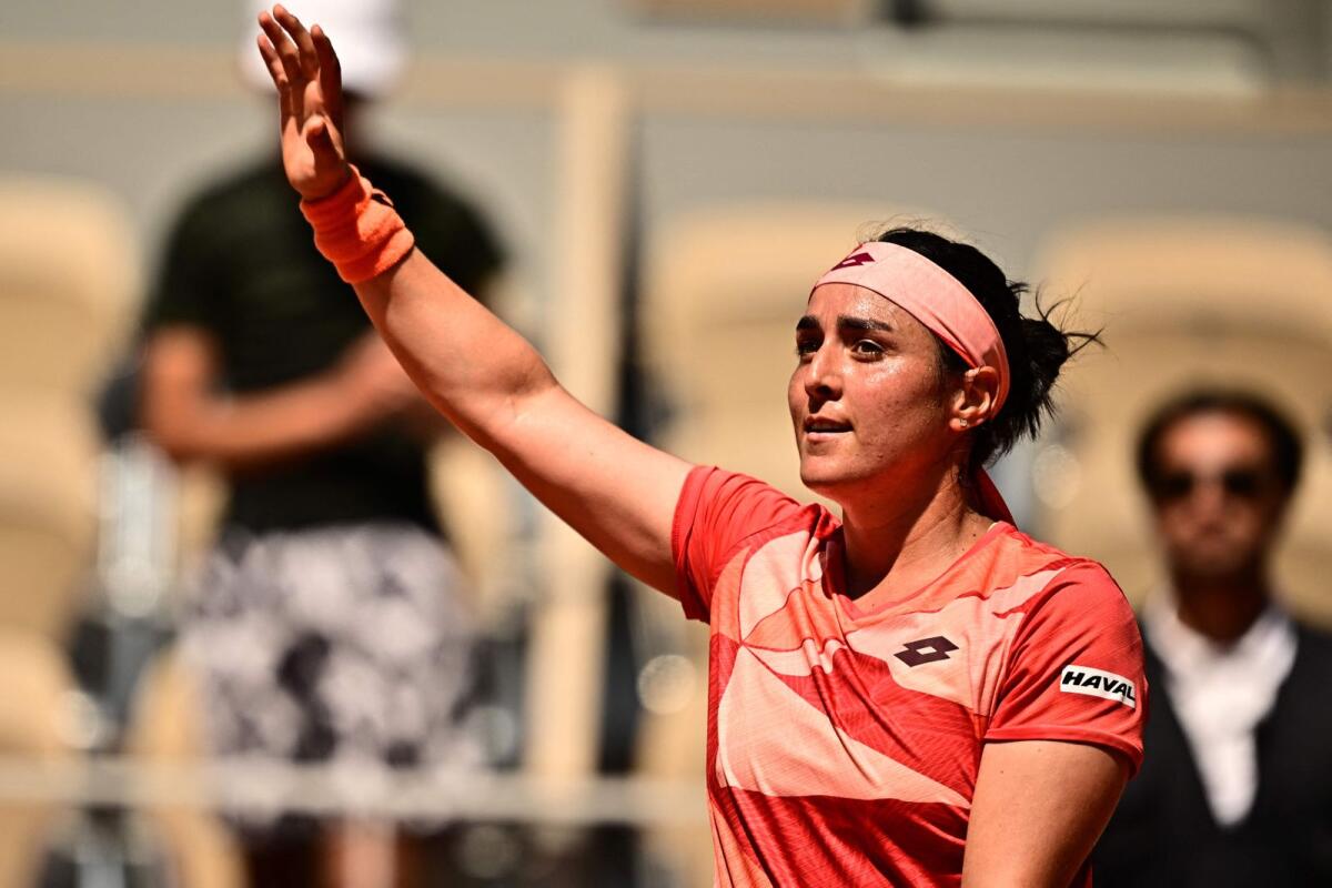 Tunisia's Ons Jabeur celebrates after winning her match. — AFP