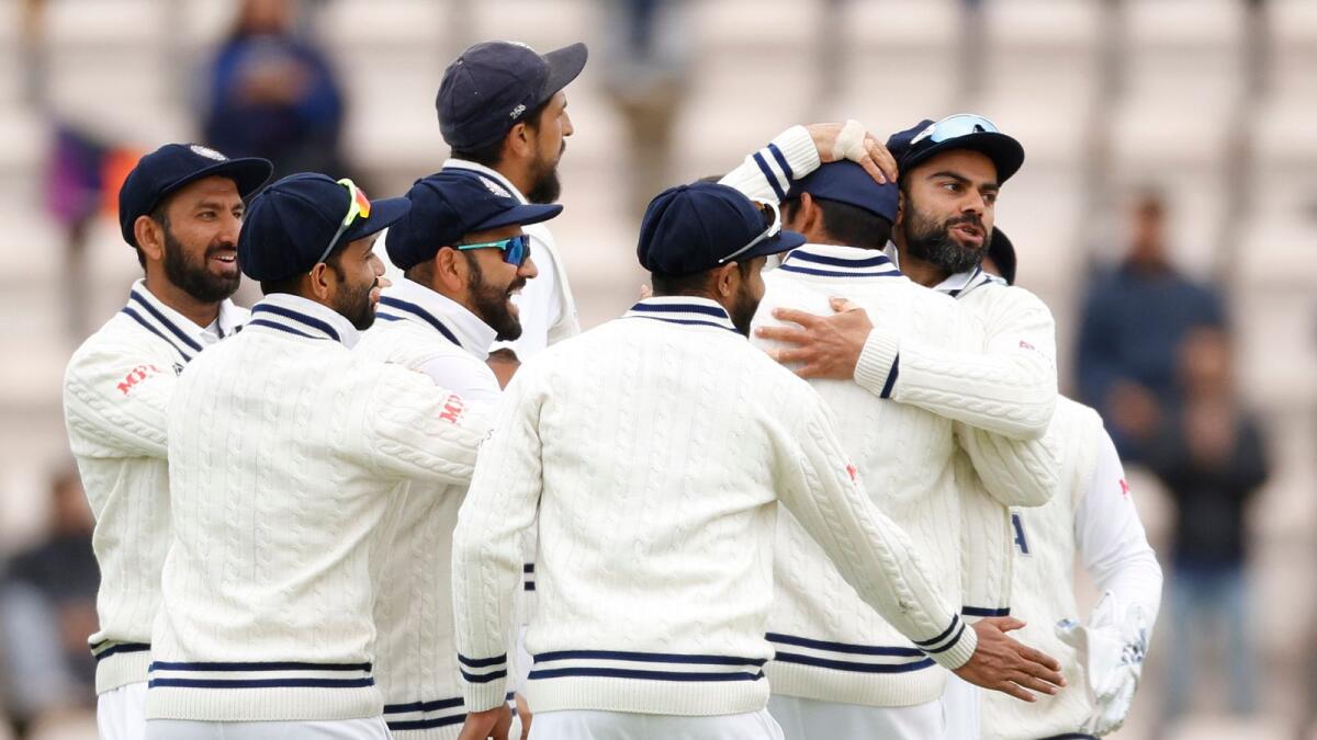 India's Mohammed Shami celebrates with teammates after taking the wicket of New Zealand's Ross Taylor. (Reuters)