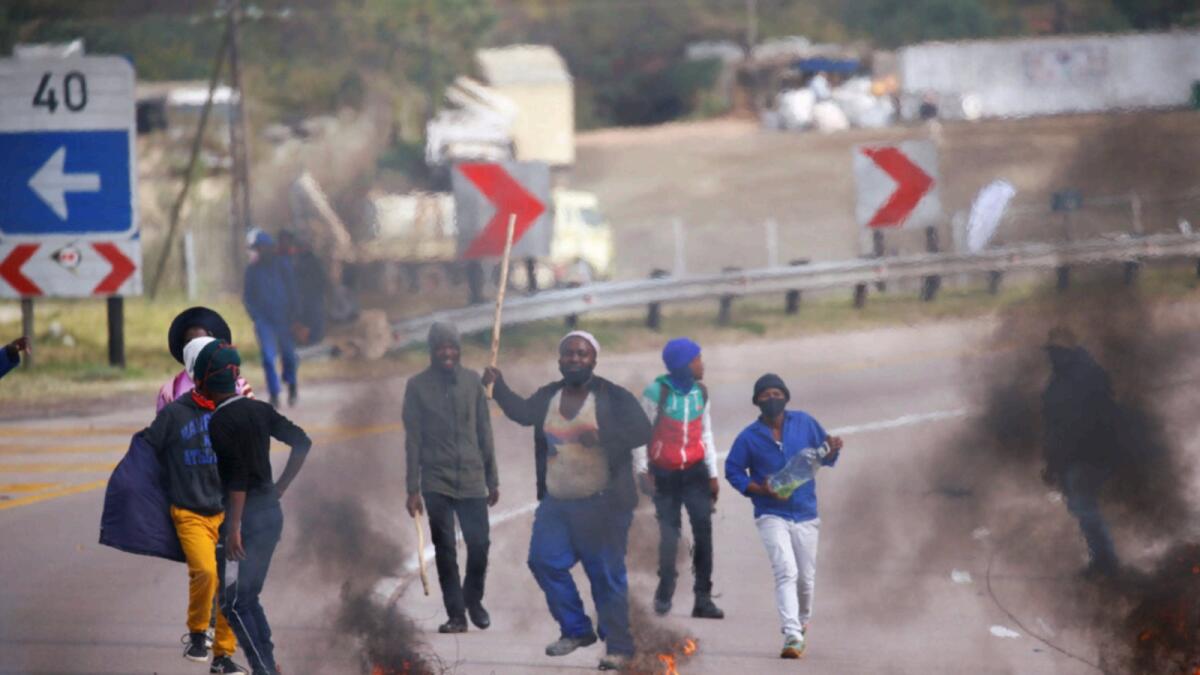 Supporters of former South African President Jacob Zuma block the freeway with burning tyres during a protest in Peacevale. — Reuters