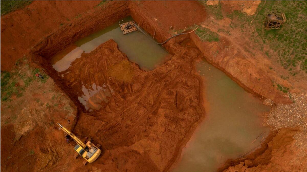 An aerial view of an illegal gold mine in Sao Felix do Xingu, in Brazil's Para state -- as investors have sought a haven from the Covid-19 chaos in gold, illegal miners have responded by hacking rust-colored scars into the plush green of the Amazon. AFP