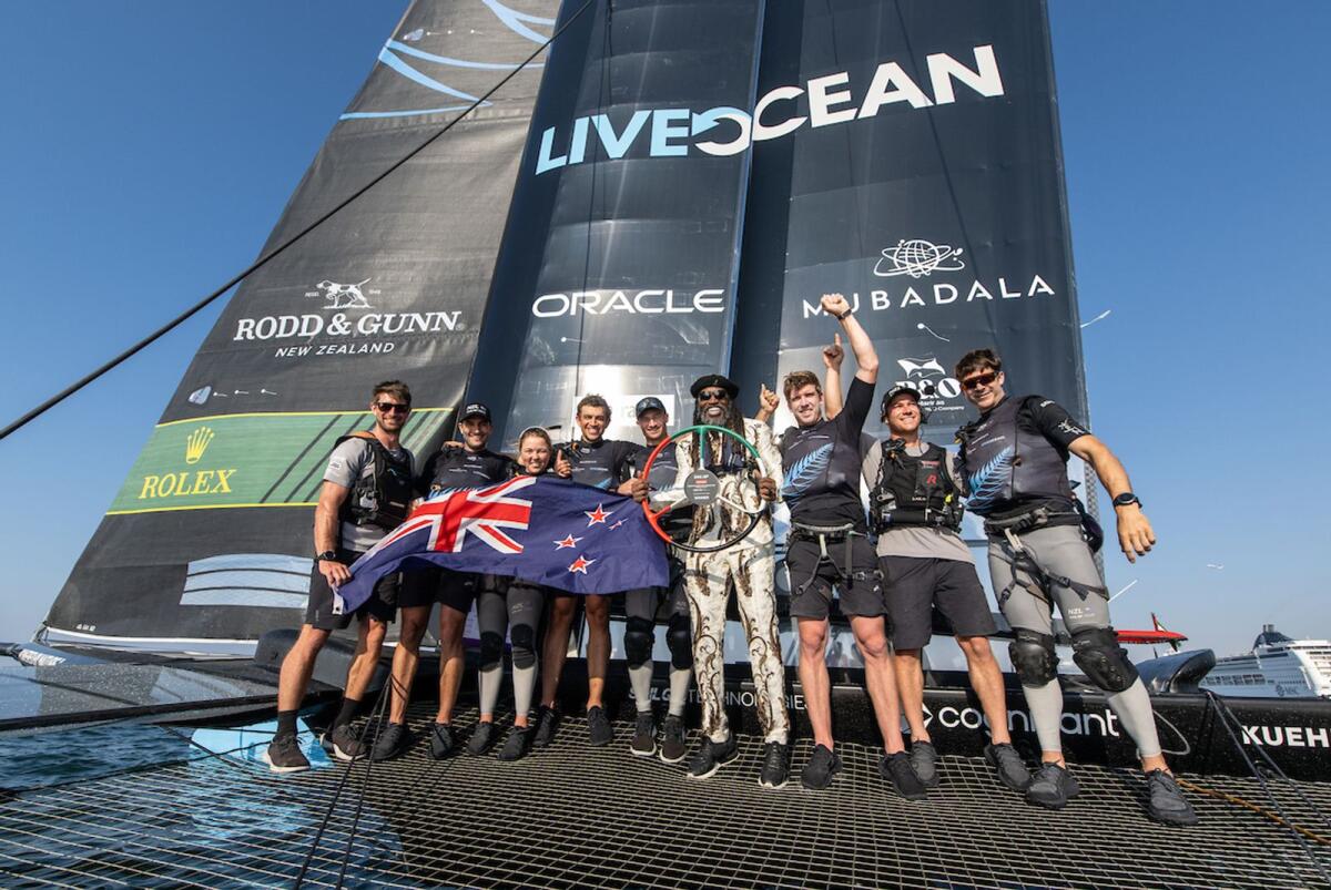 West Indies cricket superstar Chris Gayle presents the trophy to the New Zealand SailGP Team. — Supplied photo