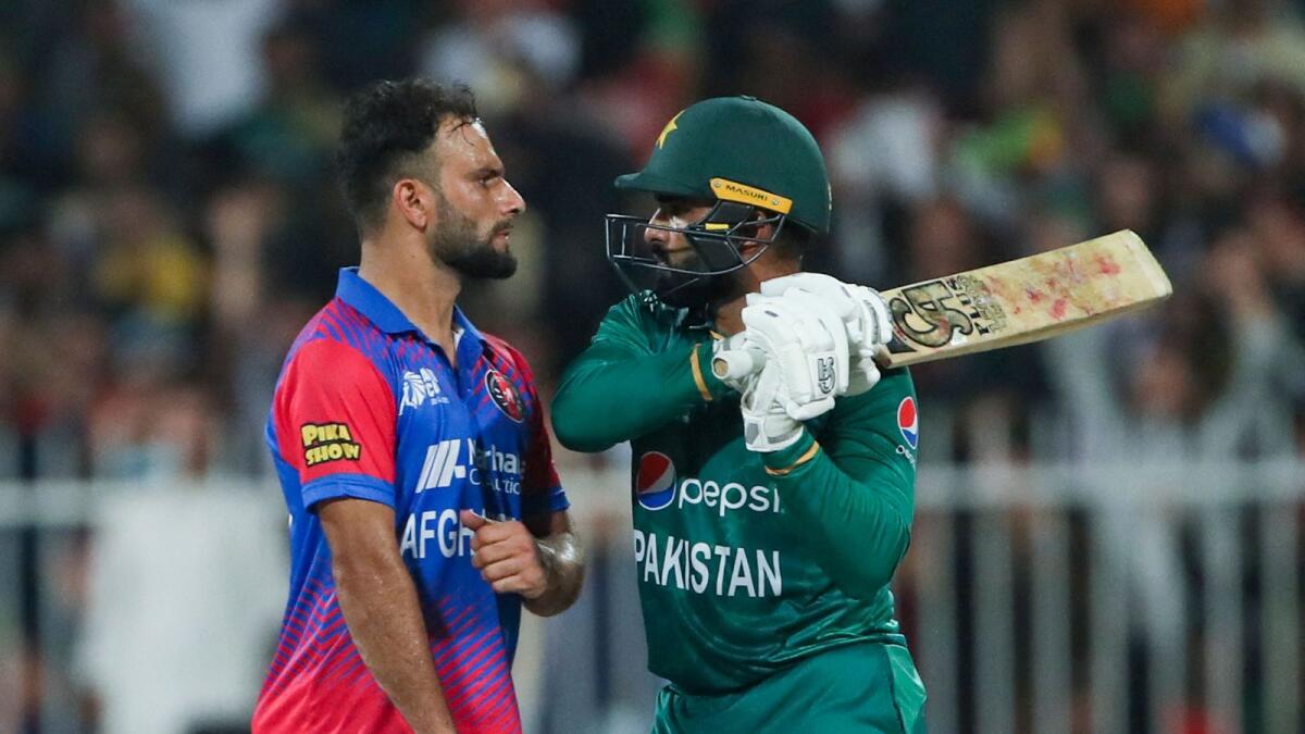 Pakistan's Asif Ali (right) and Afghanistan's Fareed Ahmad. — AFP